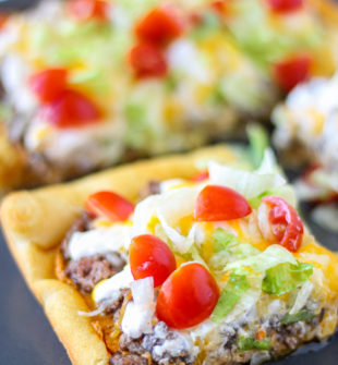 This 30 minute dinner turns fluffy crescent dough turned into pizza crust. The special cheese sauce in this Taco Pizza makes it OVER THE TOP!