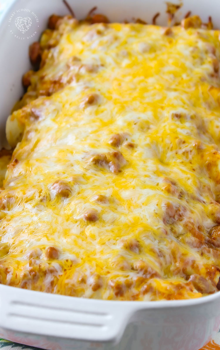 Chili Dog Casserole - 4 Ingredient easy, cheesy dish with hot dogs, chili, and beans. A quick and easy dinner recipe to make over and over again!