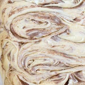 Cinnamon Roll Cake - A cinnamon roll turned into an gooey gooey cake with buttery cinnamon swirls!