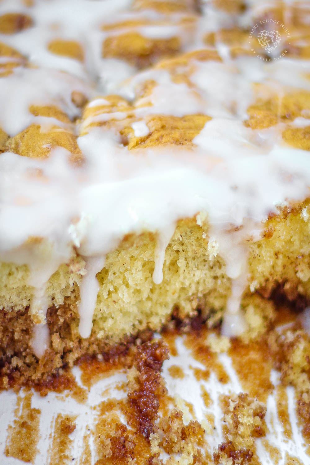 Cinnamon Roll Cake - Easy No Fuss Recipe Using Box Cake! Buttery cinnamon swirls and a sweet glaze.