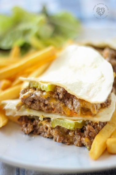 These Cheeseburger Quesadillas are easy enough to make for a quick weeknight dinner, but I also love them to serve as an appetizer (think Super Bowl!). Served with a side of fries and a salad, this recipe will be a hit! Plus, it's picky-eater approved:)