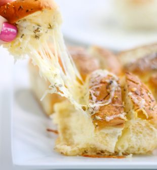 This Cheesy Hawaiian Garlic Bread will literally change your life. So much so that daughter requests this cheesy pull-apart bread for her birthday. This recipe is seriously that delicious!