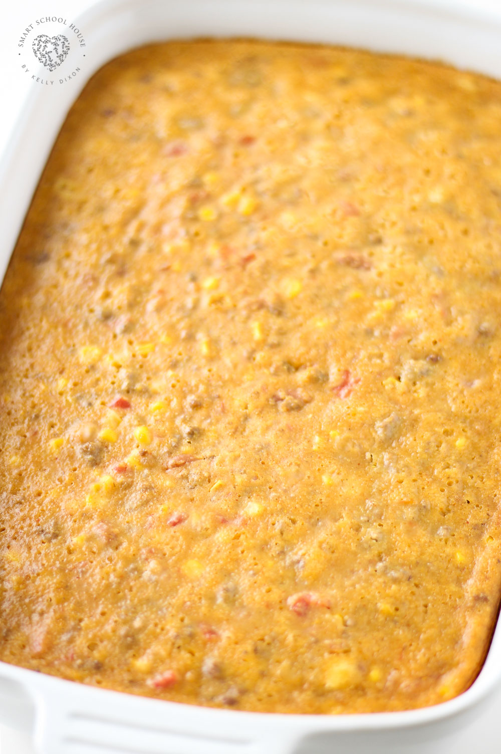 Cowboy Cornbread Casserole layers ground beef, beans, corn, cheese, seasonings, and cornbread batter into a hearty meal that everyone loves!