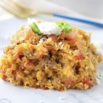 Cowboy Cornbread Casserole layers ground beef, beans, corn, cheese, and cornbread batter into a hearty meal that everyone loves!