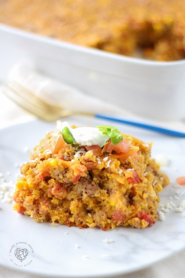 Cowboy Cornbread Casserole layers ground beef, beans, corn, cheese, seasonings, and cornbread batter into a hearty meal that everyone loves!