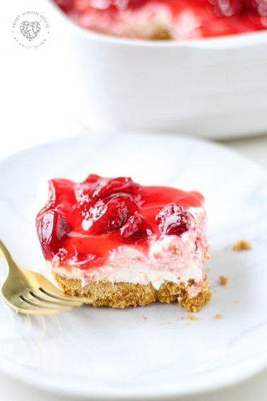 Easy Strawberry Cheesecake Bars, these irresistible squares are quick, easy and so delicious! Made with a graham cracker crust and strawberry filling. Easy and tasty bars.