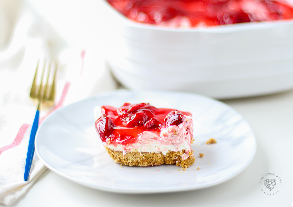 Easy Strawberry Cheesecake Bars, these irresistible squares are quick, easy and so delicious! Made with a graham cracker crust and strawberry filling. Easy and tasty bars. 