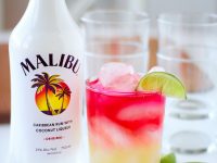 The Drink to Enjoy All Summer Long! Malibu Rum, pineapple Juice, and cranberry juice over ice with a slice of lime