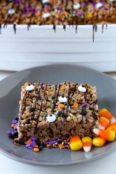These delicious chocolate Halloween Cocoa Krispies Treats are drizzled with chocolatey goodness and sprinkled for Halloween!