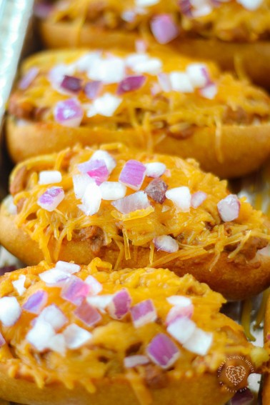 Chili Corn Dogs are a game changer! Baked corn dogs, with the stick removed, opened up and filled with chili and cheese. BRILLIANT!