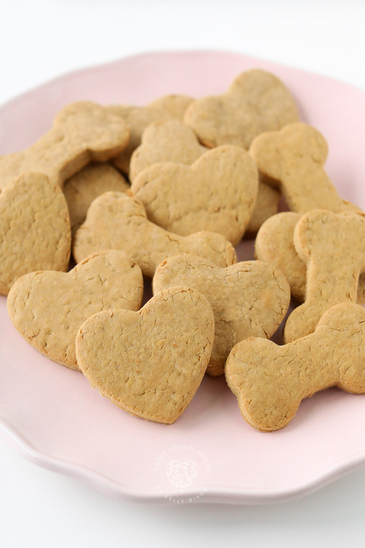 The easiest Homemade Dog Treats ever! Simply mix, roll, cut, and bake! Dogs go crazy for these peanut butter dog treats!