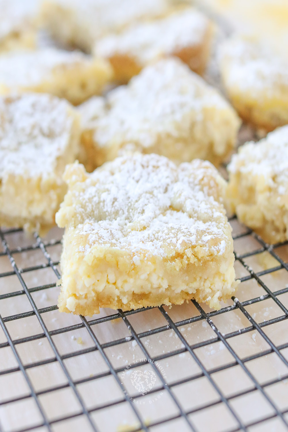 Easy Lemon Cheesecake Bars with a sugar cookie crust! The perfect combination of creamy, sweet, and tart. These lemon squares are a fuss-free recipe that pretty much anyone can make.