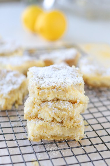 Easy Lemon Cheesecake Bars with a sugar cookie crust! The perfect combination of creamy, sweet, and tart. These lemon squares are a fuss-free recipe that pretty much anyone can make.