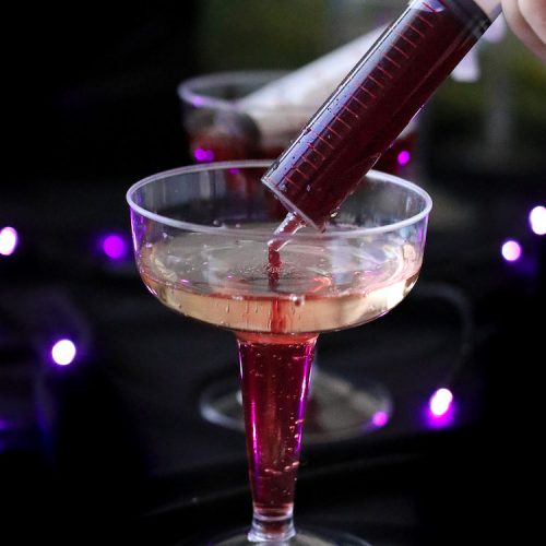Our Vampire Champagne is a festive drink on Halloween! This champagne and juice syringe drink is as fun to make as it is to drink! It can also be made kid-friendly by swapping the champagne for sparkling cider.