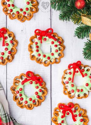 Pretzel Wreaths with a red licorice bow are an adorable and festive Christmas food craft idea!