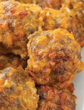 This easy recipe combines breakfast sausage and cheddar cheese for a very flavorful appetizer (think: parties, holidays, and the super bowl!). But, dipped in maple syrup alongside pancakes, you've got an AMAZING breakfast side too!