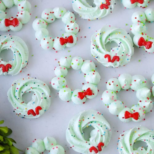 Christmas Meringue Wreath Cookies will put a smile on everyone's face this holiday season! Perfectly sweet and fluffy with an airy crunch.