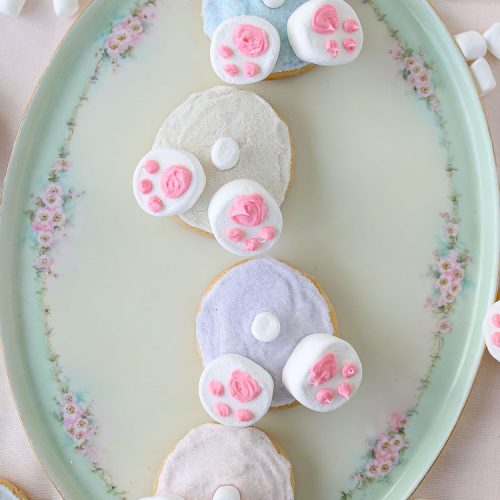 Bunny Butt Cookies are frosted Easter cookies that feature little bunny paws made with marshmallows and a little white marshmallow tail.