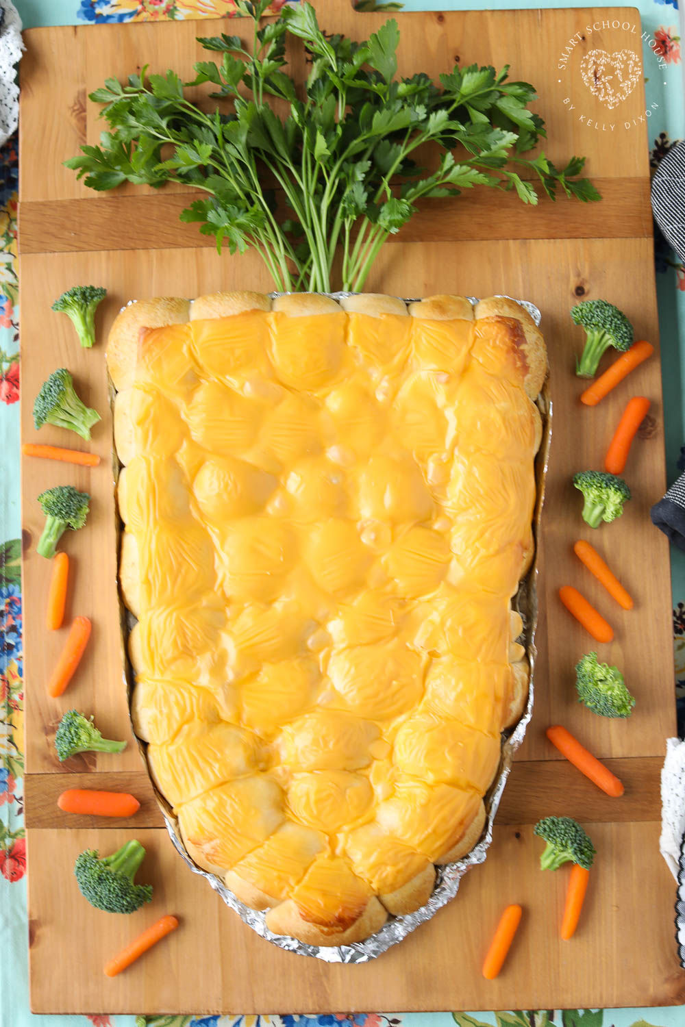 Cheesy Carrot Shaped Pull Apart Bread is made of everyone's favorite buttery biscuits rolled around cheese and shaped into a cute carrot.