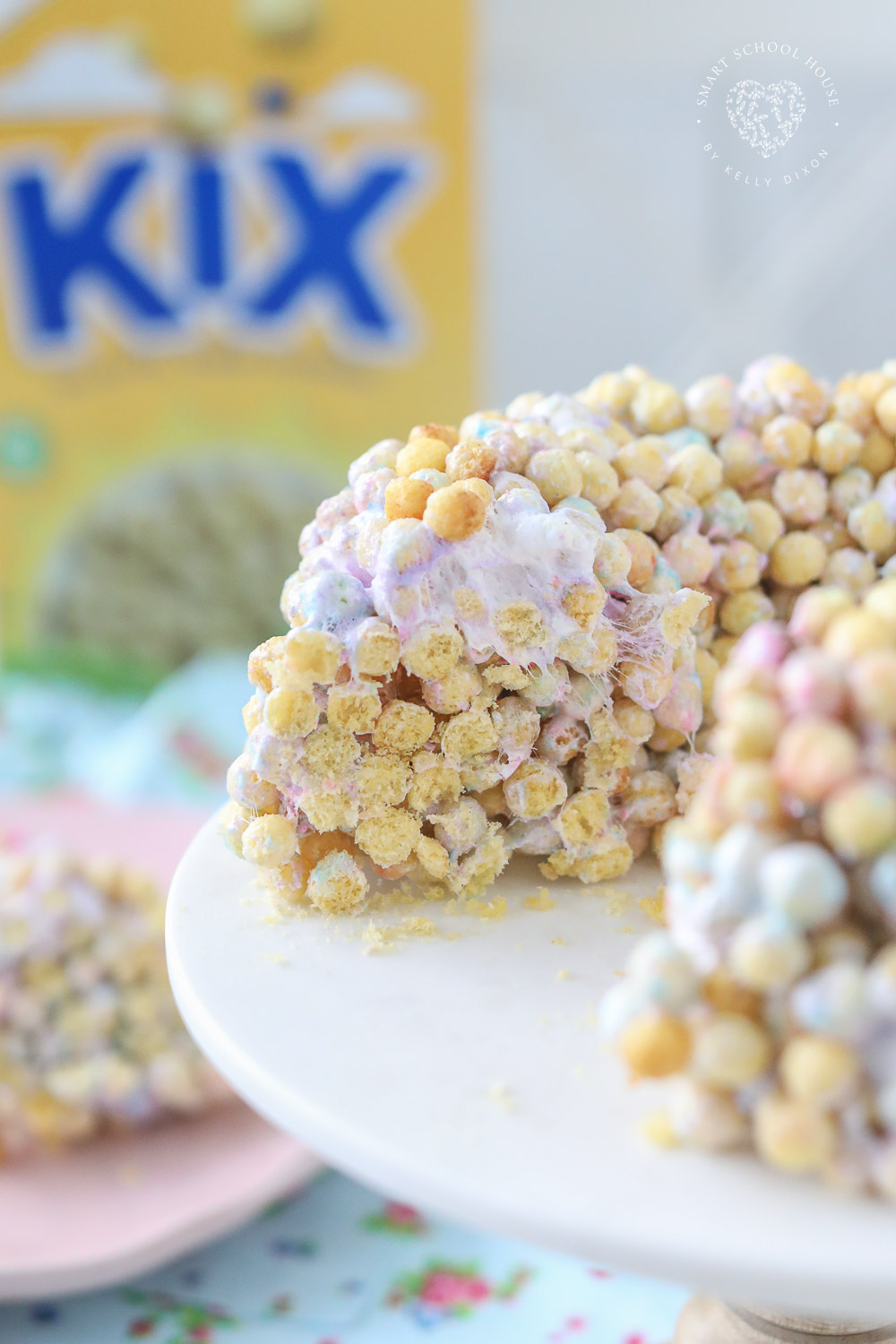 This colorful Peeps Bundt Cake is made of Kix and melted Peeps marshmallows! Made in a bundt cake pan and cut into cereal Peeps treats!