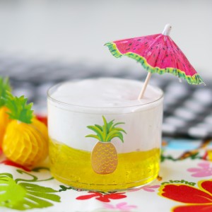 Make Dole Whip Slime for a Hawaiian sensory activity! It has a thick and clear yellow base with a white fluffy topping.