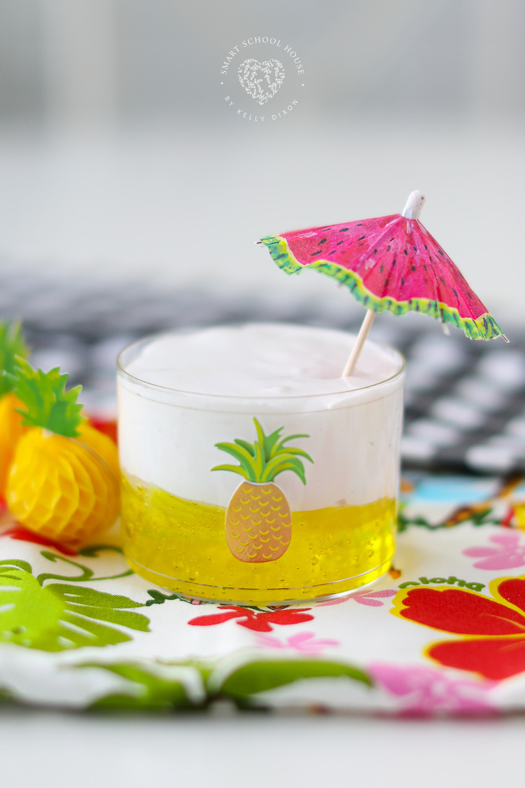 Make Dole Whip Slime for a Hawaiian sensory activity! It has a thick and clear yellow base with a white fluffy topping. 