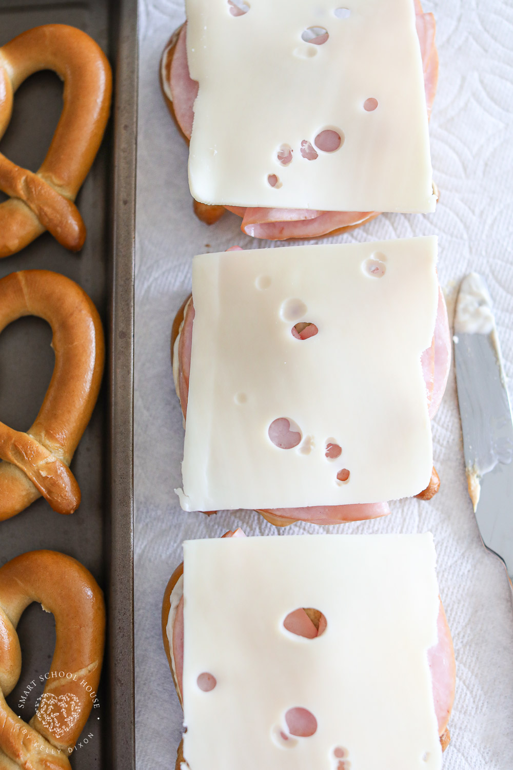 Swiss cheese on pretzels