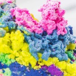 How to make Magic Sand that stays dry in the water! Also known as Aqua Sand, this fun and colorful waterproof sand is poured into water, creating a coral-like appearance that can be used over and over again!