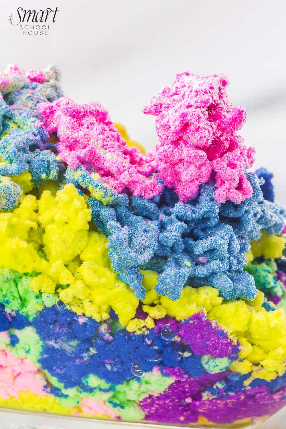 How to make Magic Sand that stays dry in the water! Also known as Aqua Sand, this fun and colorful waterproof sand is poured into water, creating a coral-like appearance that can be used over and over again! 