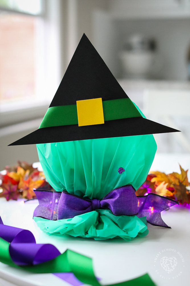 Halloween Candy Plates! Clear plastic plates, filled with candy, and wrapped to look like a green witch or cute orange pumpkin!