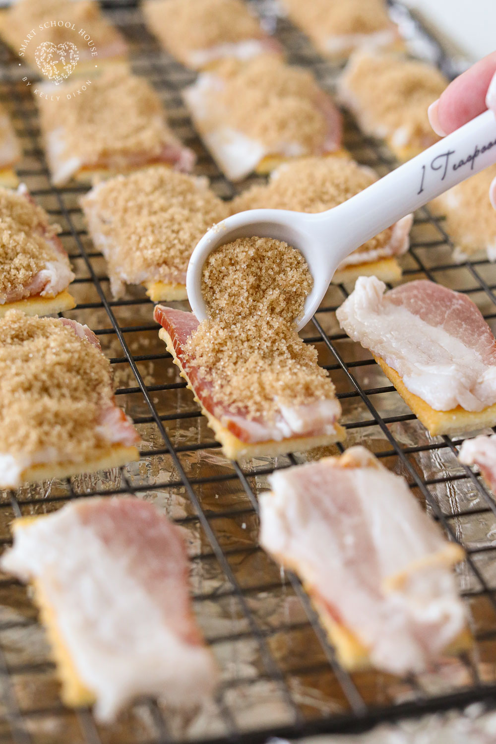 Putting brown sugar on bacon and Club crackers