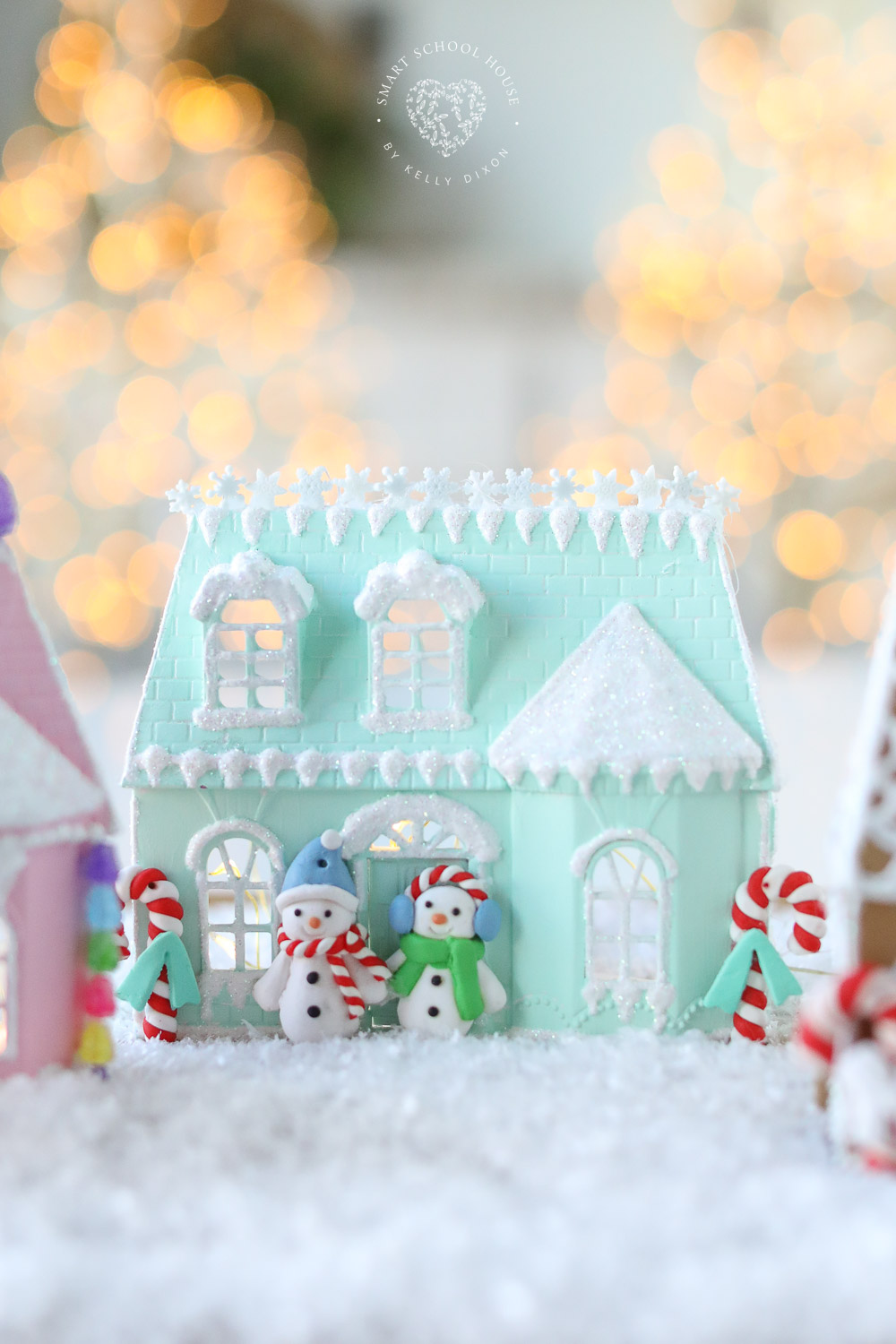 Teal gingerbread dollhouse with snowmen for Christmas