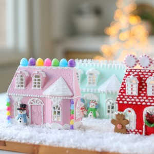 Make a gingerbread Christmas Doll House with plastic doll houses from the dollar store! They are decorated with paint, ornaments, glitter, and more. Best of all, place fairy lights behind the houses so they glow at night.
