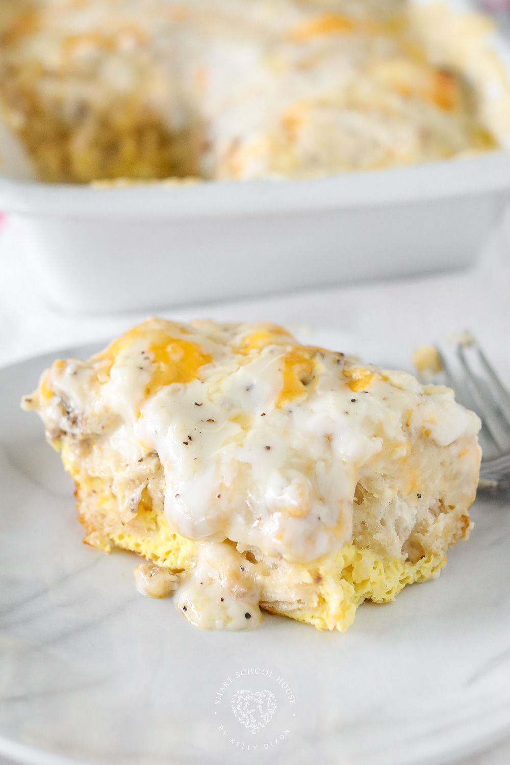Biscuit and Gravy Casserole is a comforting breakfast recipe that hits the spot every time. A fun take on traditional biscuits and gravy!