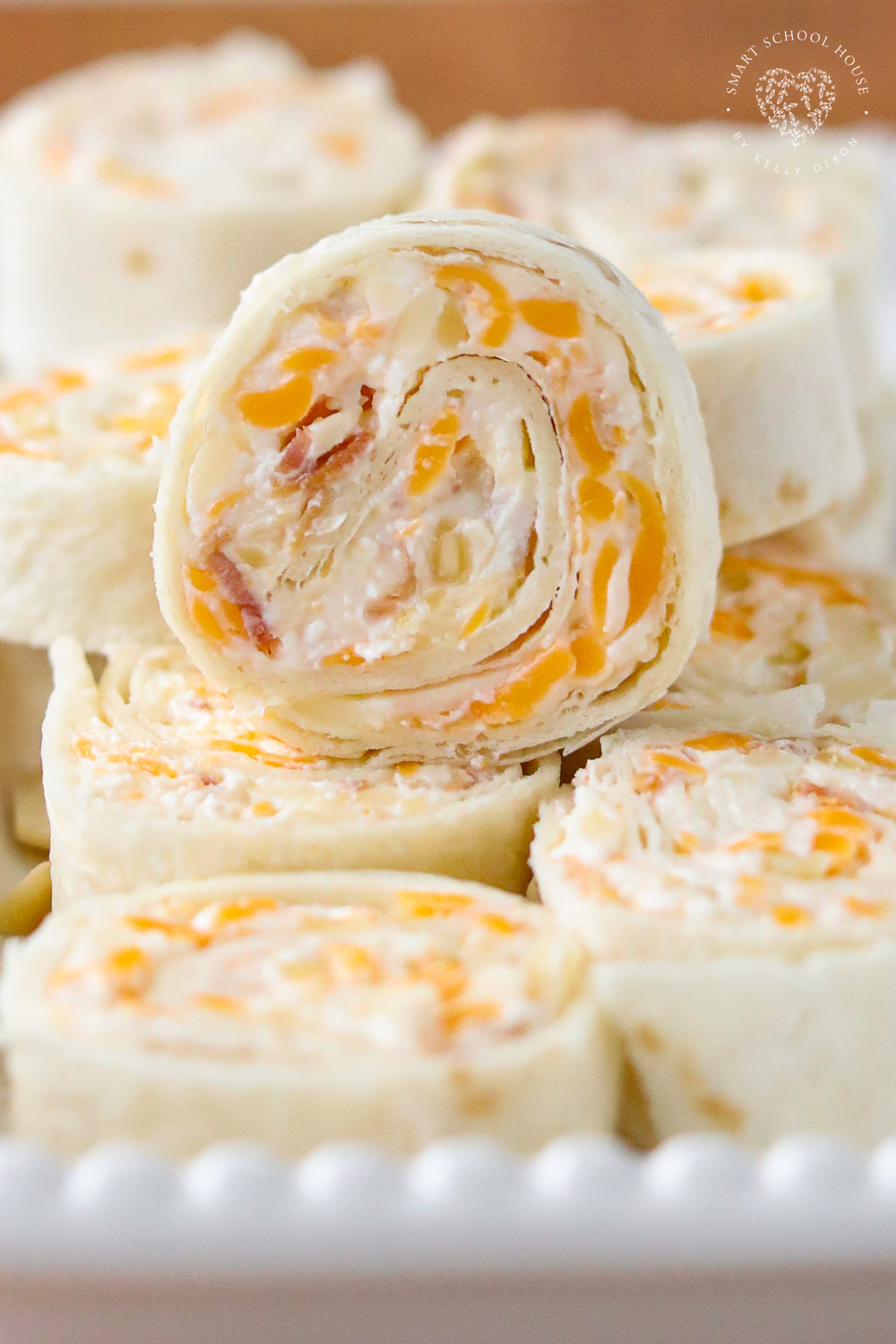 These Tortilla Roll Ups taste like a million dollars! This easy appetizer recipe has flour tortillas rolled around an amazing cheese mixture. 