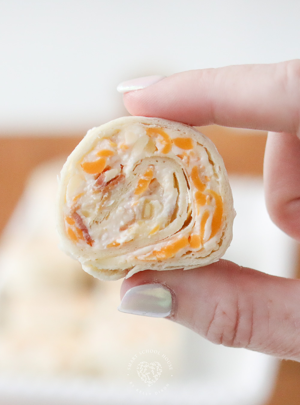 These Tortilla Roll Ups taste like a million dollars! This easy appetizer recipe has flour tortillas rolled around an amazing cheese mixture.