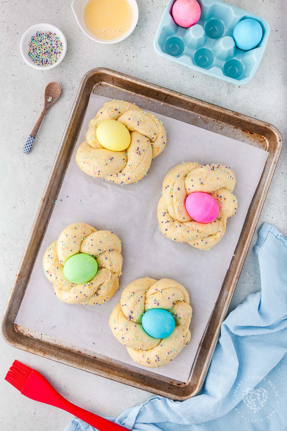 Braided dough with sprinkles and an Easter egg