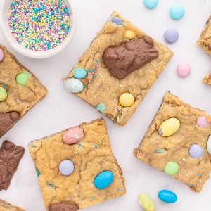 These Easter Cookie Bars are made with a delicious cookie batter, M&M’s, and topped with chocolate bunnies! If you're looking for an Easter dessert recipe, try this adorable treat!