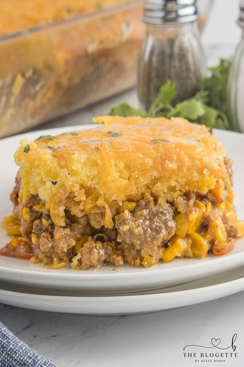 A mouthwatering, comforting, and versatile dish that combines the rich flavors of cornbread with zesty spices, tangy ingredients, and gooey melted cheese!