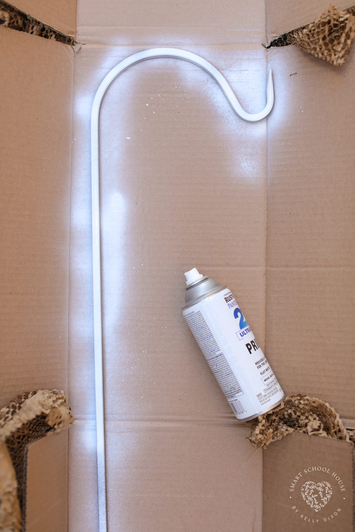 Paint the shepherd's hook white