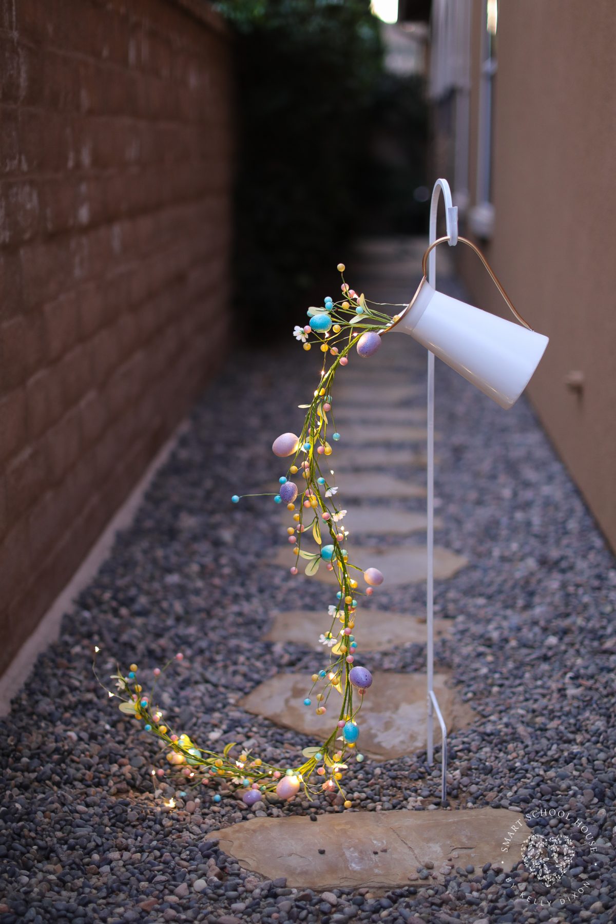 Press the hook into the ground, hang the can, and turn on the lights