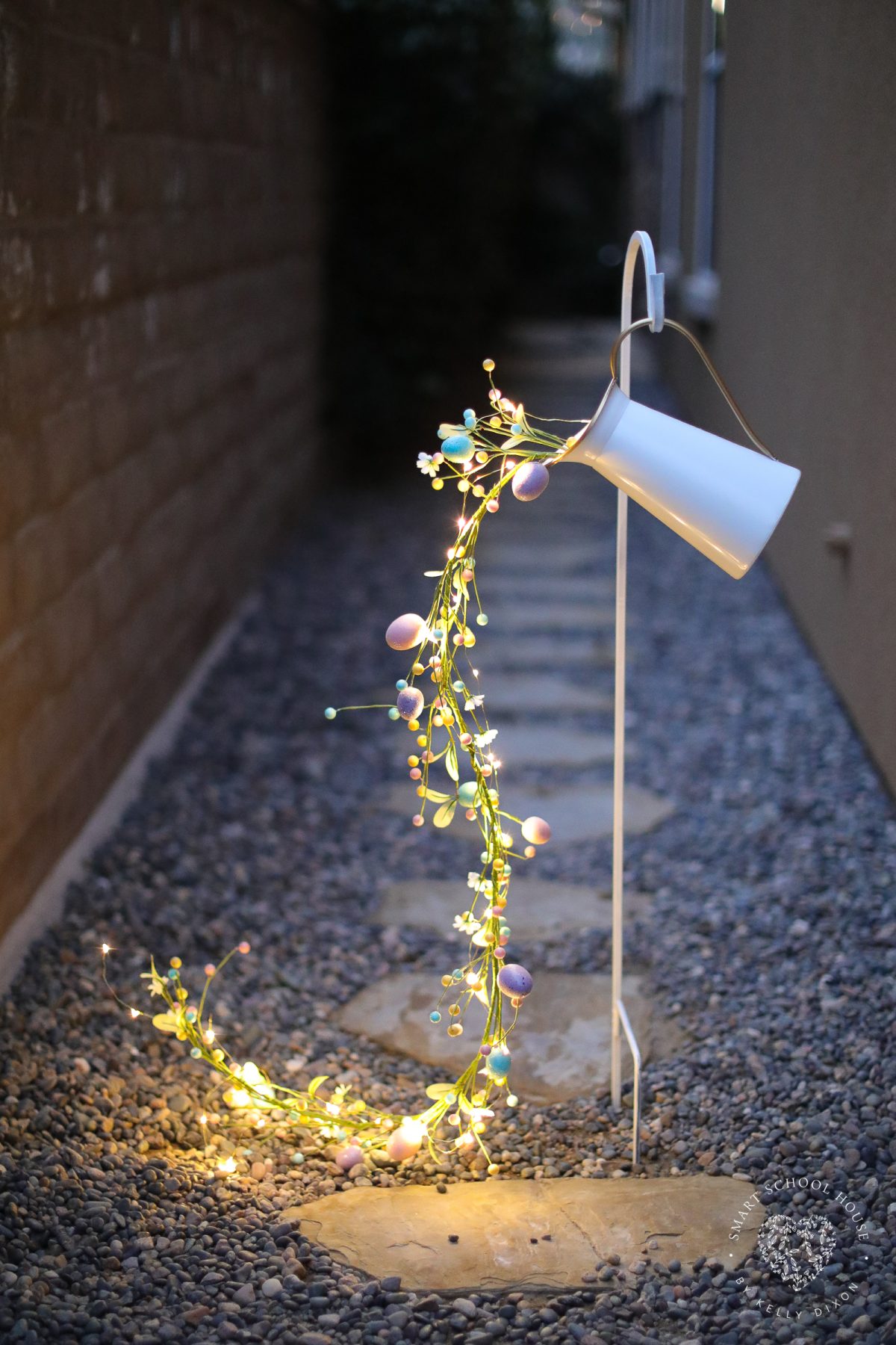 This Pouring Easter Garland is a stunning spring decor idea that looks like glowing Easter eggs spilling from a pitcher. A creative DIY Easter craft for adults that’s perfect for porches, gardens, and walkways.