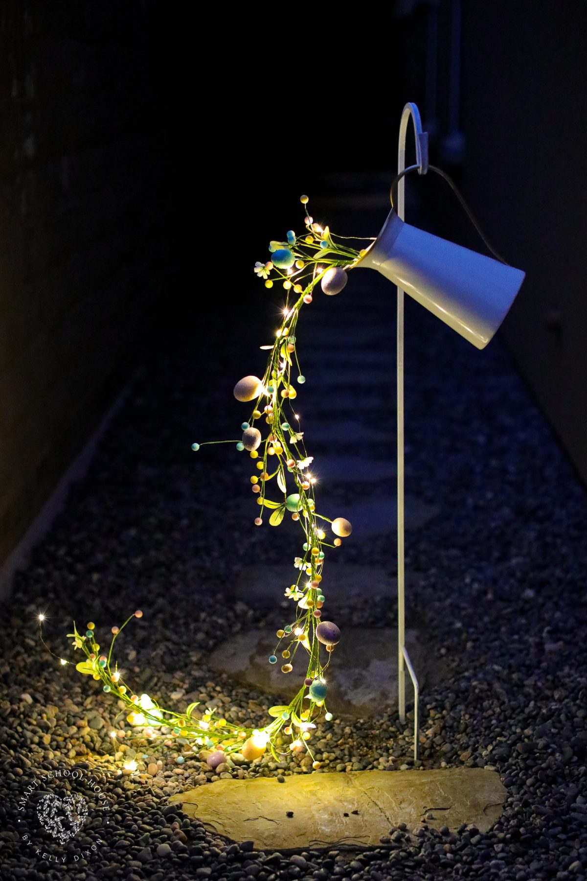 Create a magical spring display with this Pouring Easter Garland craft. A unique DIY Easter craft for adults using fairy lights, Easter egg garland, and simple supplies.
