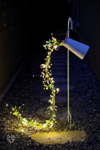 Create a magical spring display with this Pouring Easter Garland craft. A unique DIY Easter craft for adults using fairy lights, Easter egg garland, and simple supplies.