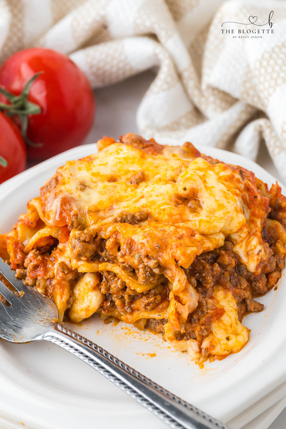 Easy Lasagna features layers of pasta, hearty meat sauce, creamy cheese, and melted mozzarella.