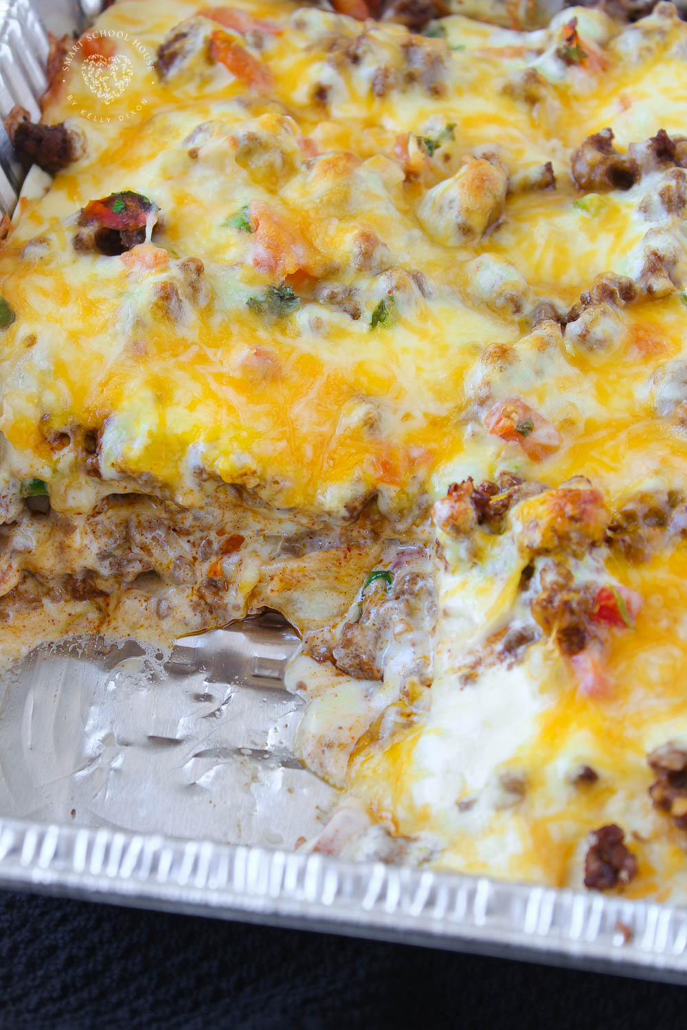 Taco Lasagna layers seasoned beef, tortillas, cheese, and flavorful taco ingredients into one crowd-pleasing casserole.
