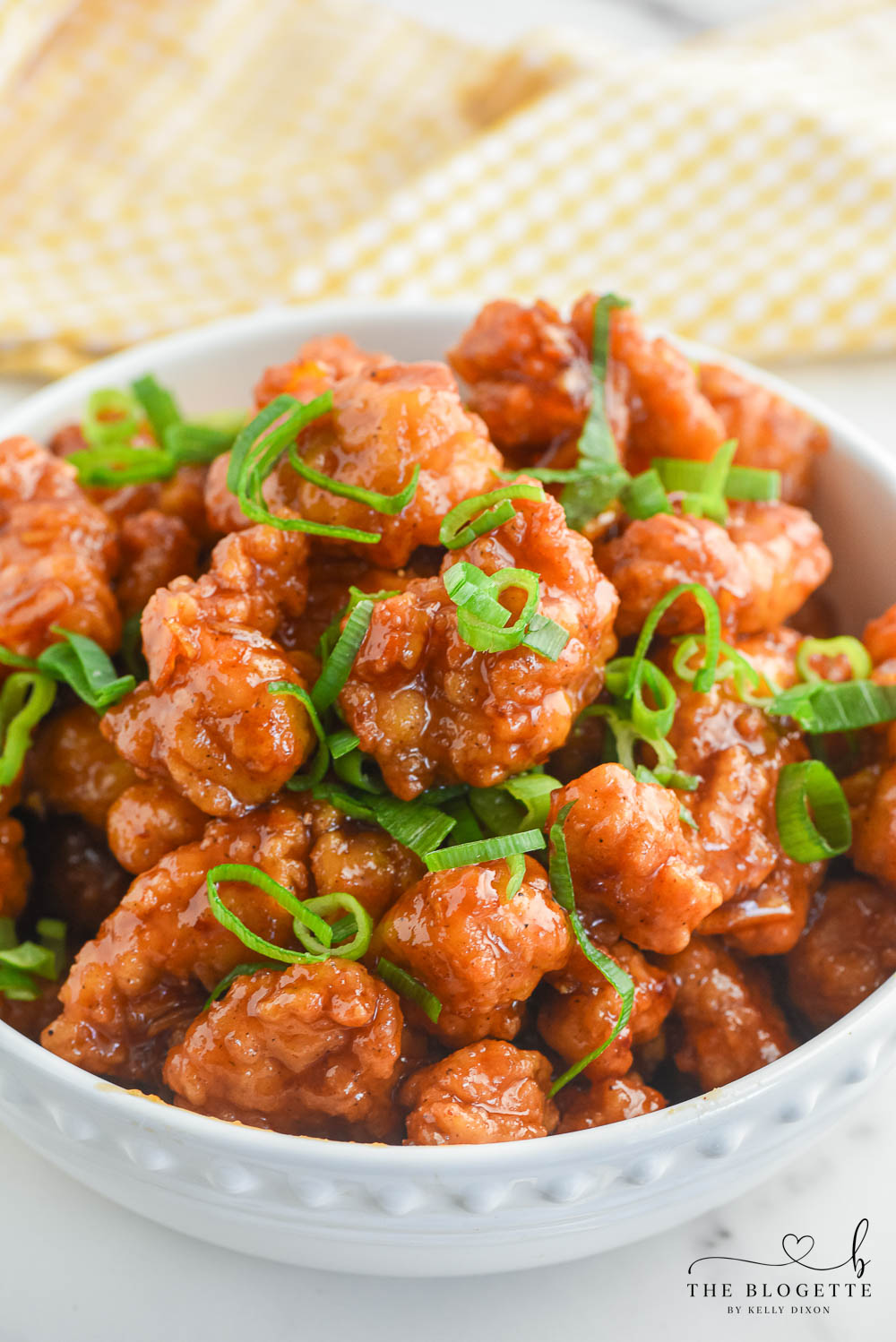 Homemade Orange Chicken features crispy pieces of chicken coated in a bright, sweet, and tangy orange sauce.